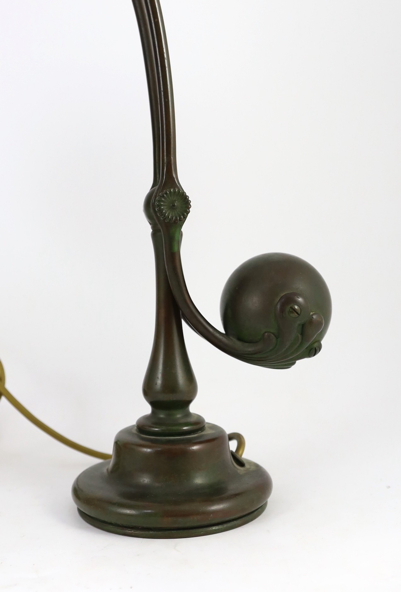Tiffany Studios, a counter-balance patinated bronze desk lamp with ‘favrile’ glass shade, c.1905, maximum height 41cm, shade 17.3cm diameter